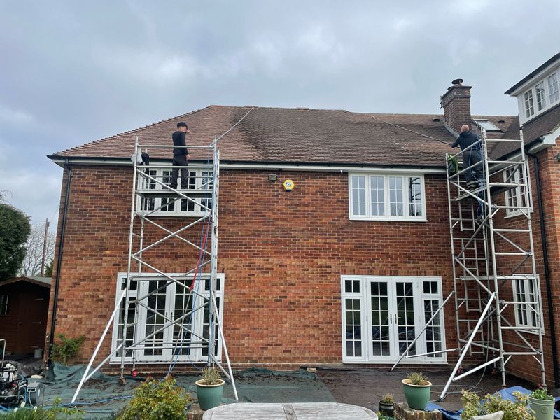 Roof cleaning carried out safely from scaffold towers by The Roof Moss Cleaners in Chippenham